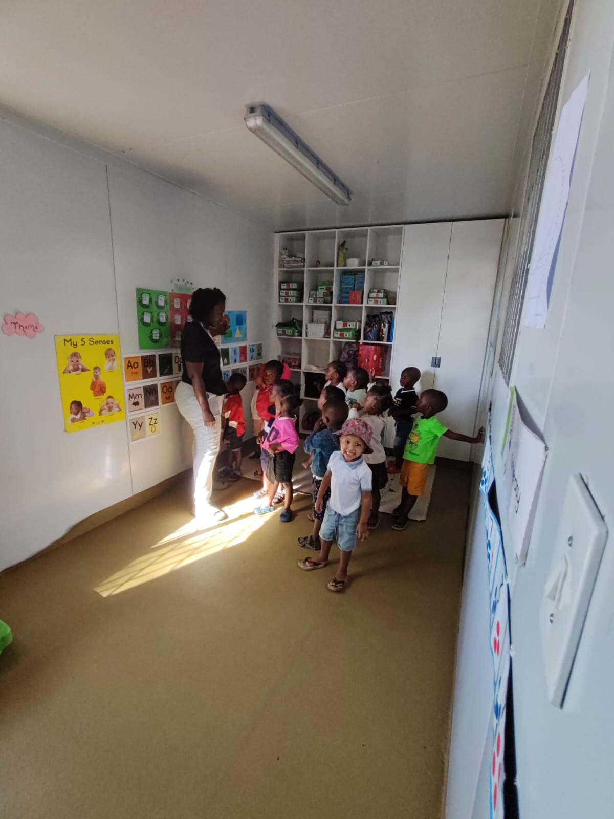 Karin Kriel with children at an NXT Move site in South Africa